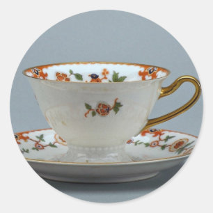 Cup und Untertasse mit bunten Blume darauf. Runder Aufkleber