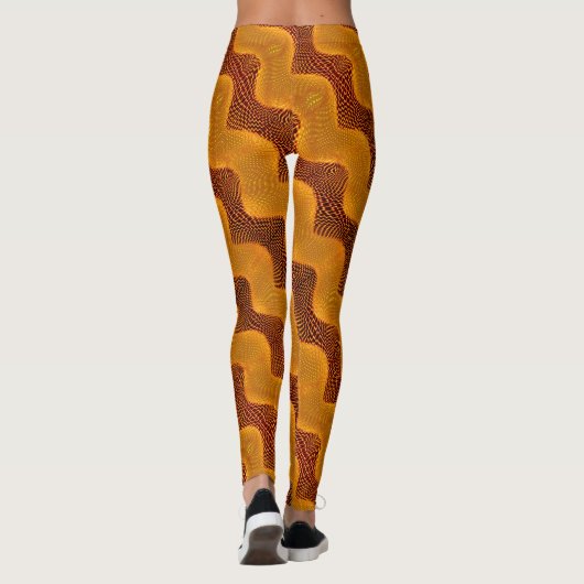 Curva laranja e pontos dourados sobre fundo marrom leggings (Rückseite)