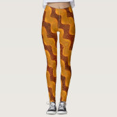 Curva laranja e pontos dourados sobre fundo marrom leggings (Vorderseite)
