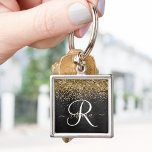 Custom Gold Glitzer Black Sparkgram Monogram Schlüsselanhänger<br><div class="desc">Dieses trendige und elegante Design mit hübschem goldglänzenden Glitzer auf schwarz gebürstetem metallischem Hintergrund verleiht diesem Schlüsselanhänger eine angenehme Note.</div>