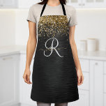 Custom Gold Glitzer Black Sparkgram Monogram Schürze<br><div class="desc">Dieses trendige und elegante Design mit hübschem goldglänzenden Glitzer auf schwarz gebürstetem metallischem Hintergrund ist einfach zu personalisieren.</div>