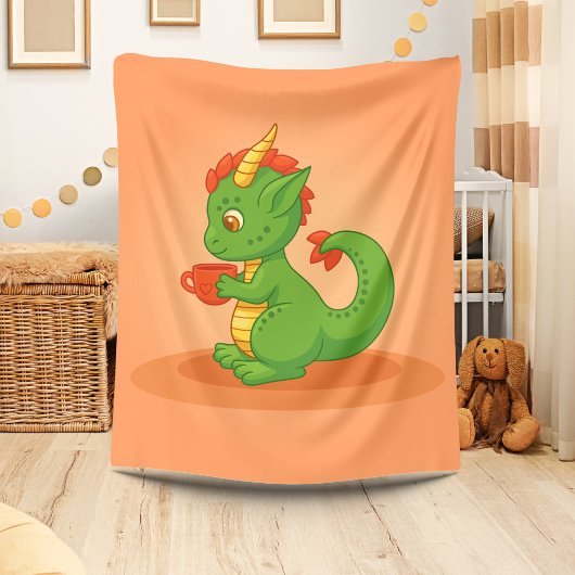 Cute Baby Dragon Holding Cup on Orange Fleecedecke