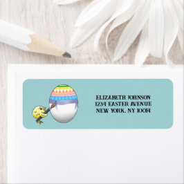 Cute chick paints a beautiful Easter egg