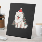 Cute Dog wearing Santa hat and Christmas tree Clas Sockelschild (In Situ)