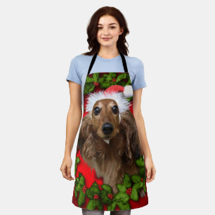 Cute dog with Santa's red hat and garland Schürze