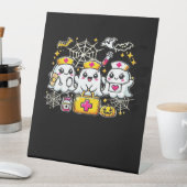 Cute Halloween Ghost Nurse Trio with Medical Kit a Sockelschild (In Situ)