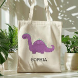 Cute Purple Dinosaur Personalized Tote Bag Tragetasche<br><div class="desc">This girls' tote bag features a cute illustration of a purple and green dinosaur with pink spots and long eyelashes. Personalize it with your child's name in black letters. Makes a great book bag!</div>