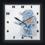 Cute Snowman in Winter Photograph Christmas Quadratische Wanduhr<br><div class="desc">A clock with a cute photograph of a little snowman. Standing outside in the winter with snow falling all around. This cute little guy is dressed up in blue knitted hat and scarf.</div>