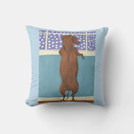 Dachshund am Fenster beim Schneebeobachten Kissen