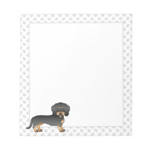 Dachshund mit schwarzem und braunem Drahtfell und  Notizblock