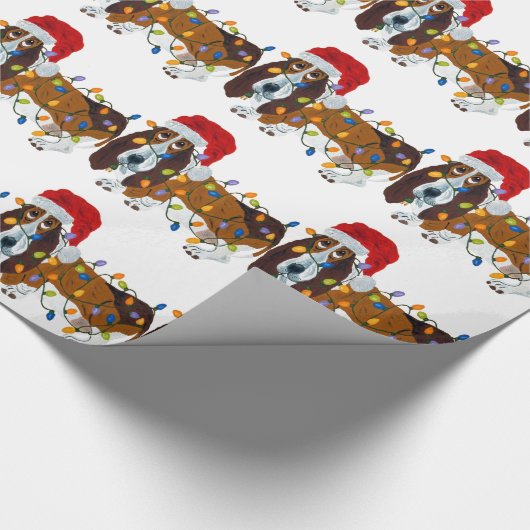 Dachshund verwirrt in den Weihnachtslichtern Geschenkpapier (Ecke)