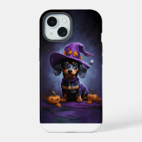 Dachshund-Zauberer-Welpe mit Halloween-Kürbis