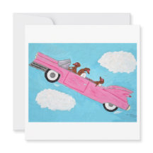 Dachshunde in einem rosa Cabrio im Himmel