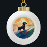 Dackel Beach Surf Malerei Keramik Kugel-Ornament<br><div class="desc">Tauchen Sie ein in die spielerische Welt des Kaninchen-Abenteuers mit diesem faszinierenden Bild. Ein gepflegter Hund geht zu den Wellen und reitet geschickt auf einem sonnengeküssten Strand. Das lebendige Kunstwerk vereint wunderbar das Wesentliche der Erregung am Strand, während der Hund furchtlos auf den Wellen reitet und den Geist von Spaß...</div>