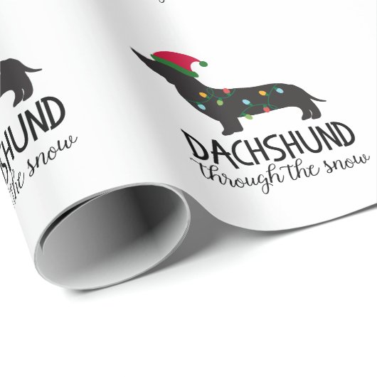 Dackel durch das Schnee-Verpackungs-Papier Geschenkpapier (Rolleneckpunkt)