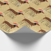 Dackel durch das Schneedeckungspapier Geschenkpapier (Ecke)