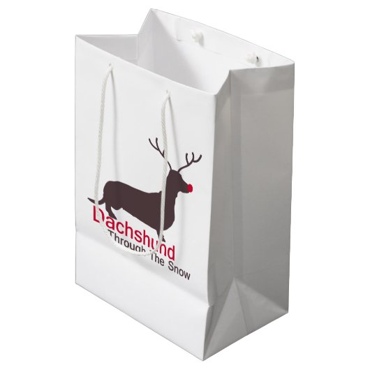 Dackel durch den Schnee Mittlere Geschenktüte (Vorderseite Schrägansicht)