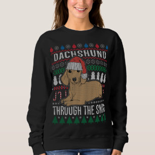 Dackel durch den schneebedeckten Weihnachtssüßer Sweatshirt
