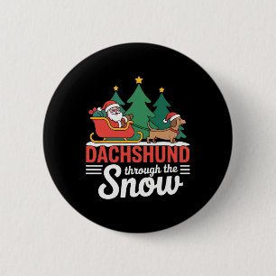 Dackel durch den schneefestlichen Weihnachtsfeiert Button