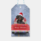 Dackel Hund im Schnee sitzen im Weihnachtswagen Geschenkanhänger (Rückseite)