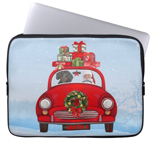 Dackel mit dem Weihnachtsmann im Auto Laptopschutzhülle (Vorderseite)