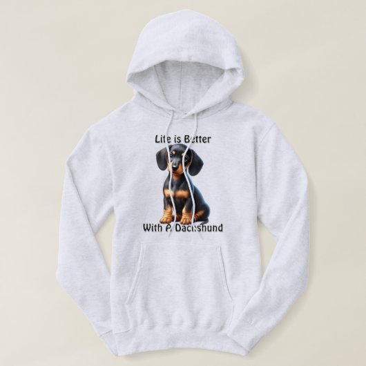 Dackel Welpe sitzen und mit unschuldig suchen Hoodie (Design vorne)