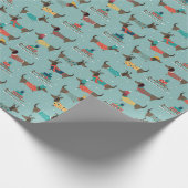 Dackeln mit Geschenken und Schlitten Muster Geschenkpapier (Ecke)