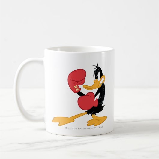 DAFFY DUCK™ der Boxer Kaffeetasse (Links)