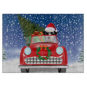 Dalmatiner fährt Auto im Schnee Weihnachten Schneidebrett