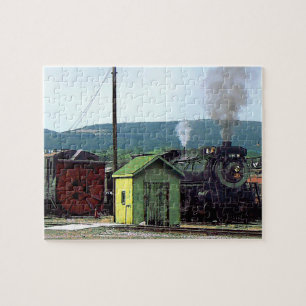 Dampflokomotive fährt in den Bahnhof ein Puzzle