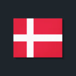 Dänische Flagge Leinwanddruck<br><div class="desc">In diesem Design ist die Nationalflagge Dänemarks zu sehen, ein nordisches Land in Nordeuropa. Das dänische Festland, das südlichste der skandinavischen Regionen, besteht aus einer Halbinsel, Jutland, und einem Archipel mit 443 Inseln, von denen die größte Zealand, Funen und die nordjutlandische Insel sind. Dänemark liegt südwestlich von Schweden, südlich von...</div>