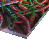 Das Augen-Chili-Paprikaschoten des Vogels Schneidebrett (Ecke)