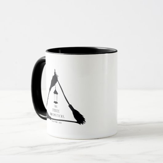 DAS DREI BROOMSTICKS™-Logo Tasse (Vorderseite Links)