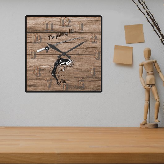 Das Fischleben mit der Angelrute Quadratische Wanduhr