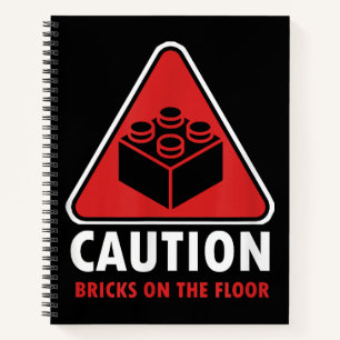 Das Gebäude "Funny Warning Caution" blockiert Stei Notizblock