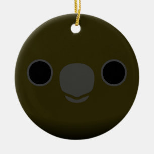 Das Gesicht eines männlichen, glänzenden schwarzen Keramik Ornament