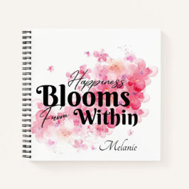 Das Glück blüht aus dem Inneren des Notebooks Notizblock