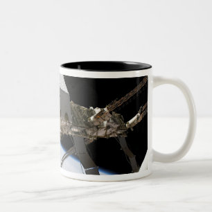 Das kanadische Dextre-Robotersystem Zweifarbige Tasse