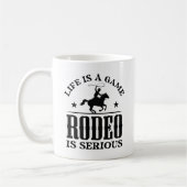 Das Leben ist ein Spiel Rodeo ist ernst Kaffeetasse (Links)