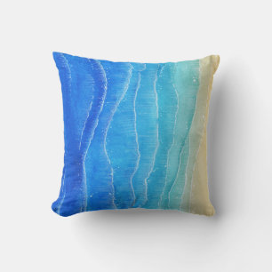 Das Meer und der Strand sind in Aquarellen gehalte Kissen