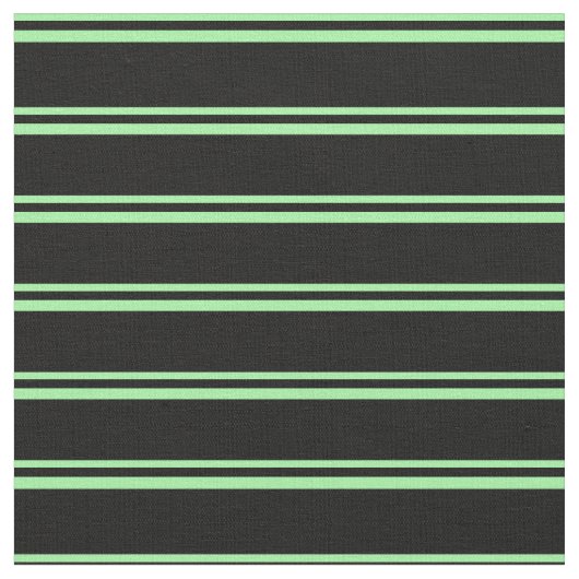 Das Muster ist grün und schwarz. Stoff (Nahaufnahme)