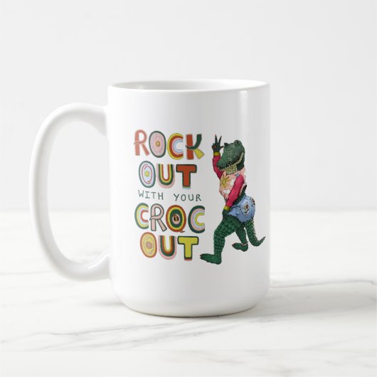 Das schöne Krokodil-Puck mit dem Croc Out Kaffeetasse (Links)