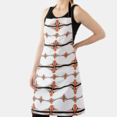 Deko-Elemente in pastellorangefarbener Schürze (InSitu)