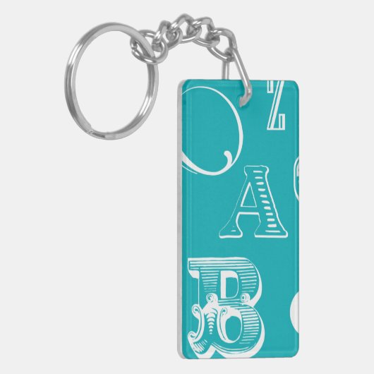 Dekorative Buchstaben auf blauem Hintergrund Schlüsselanhänger (Vorderseite links)