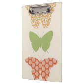 Dekorative Schmetterlingsmuster auf Cremehintergru Klemmbrett (Links)