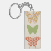 Dekorative Schmetterlingsmuster auf Cremehintergru Schlüsselanhänger (Vorderseite links)