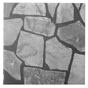 Dekorativer grauer Steinpflasternblick Fliese