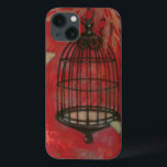 Dekorativer Käfig mit Schmetterlingen iPhone 13 Hülle<br><div class="desc">In diesem Gemälde von Norman Wyatt schweben zwei blasse Schmetterlinge um einen Vogelkäfig. Blätter hängen über dem Vogelkäfig,  und alles Erholungen auf einem grauen Hintergrund. Bestellen Sie diesen Ausdruck noch heute!</div>
