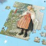 Dekorieren des Weihnachtsbaumes - Carl Larsson Puzzle<br><div class="desc">Schwedische Kunst des Künstlers Carl Larsson. Ein blondes Mädchen in traditionellem Kleid steht auf einem Stuhl, um den Weihnachtsbaum zu schmücken. Sehen Sie, wo Sie die Dinge koordinieren können! Über den Künstler: Carl Larsson war schwedischer Maler, Illustrator, Druckerei und Schriftsteller. Heute erinnert er sich vor allem an seine Aquarellen des...</div>