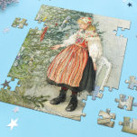 Dekorieren des Weihnachtsbaumes - Carl Larsson Puzzle<br><div class="desc">Schwedische Kunst des Künstlers Carl Larsson. Ein blondes Mädchen in traditionellem Kleid steht auf einem Stuhl, um den Weihnachtsbaum zu schmücken. Sehen Sie, wo Sie die Dinge koordinieren können! Über den Künstler: Carl Larsson war schwedischer Maler, Illustrator, Druckerei und Schriftsteller. Heute erinnert er sich vor allem an seine Aquarellen des...</div>